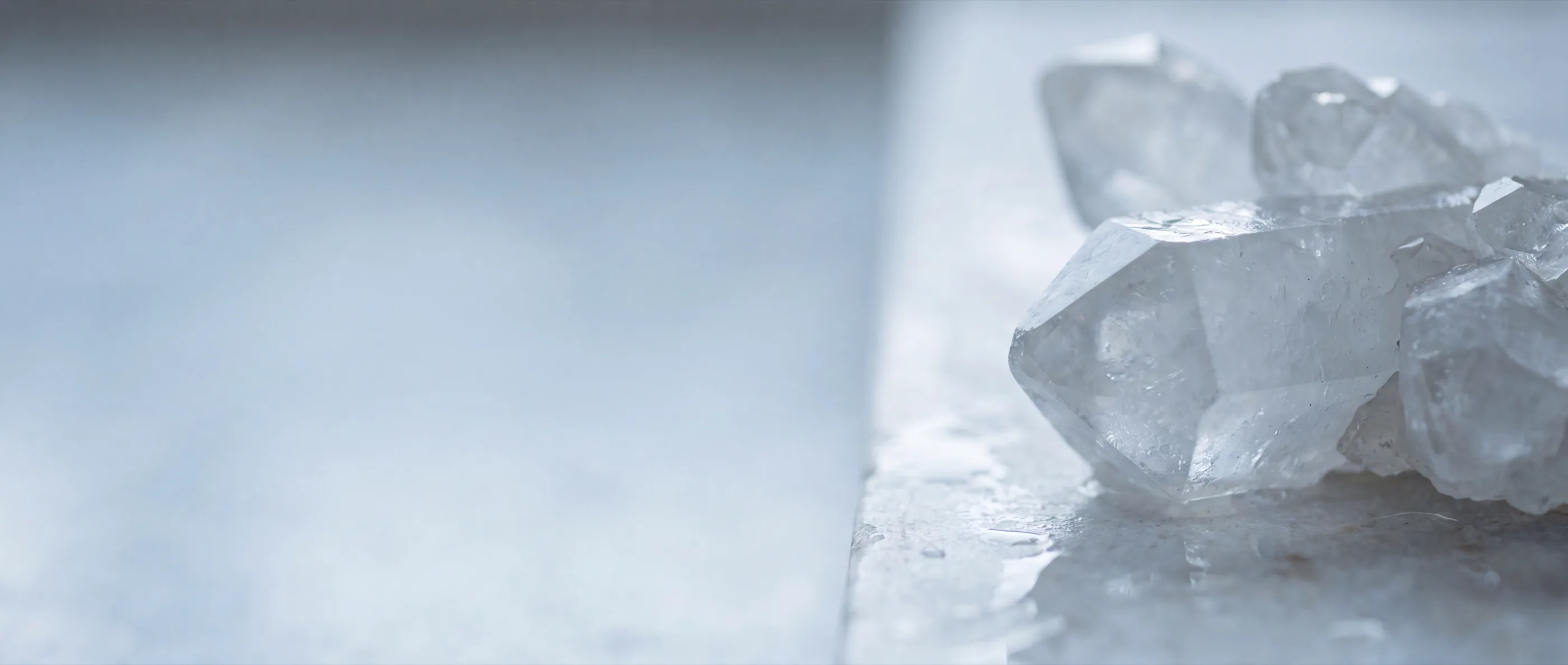 Quartz crystals on a pale stone surface