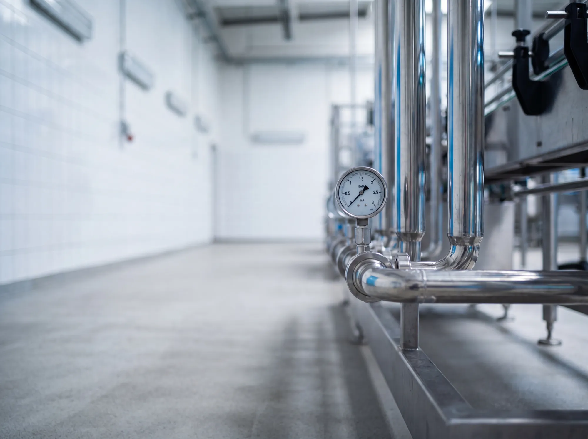 Stainless steel pipes and a pressure gauge in a clean water facility